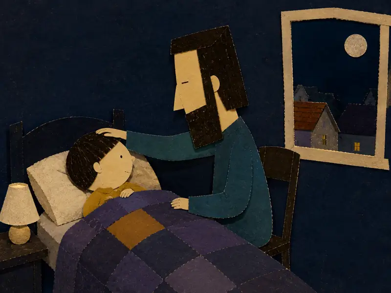 Theo lies awake while Daddy gently strokes his hair beside the bed.